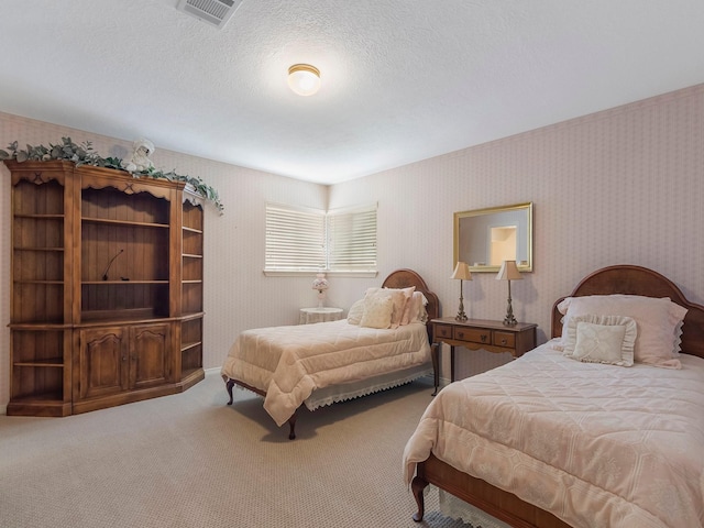 23222 Red Oak Trl, Tomball, TX 77377 - bedroom with carpet floors, wallpapered walls, and a textured ceiling