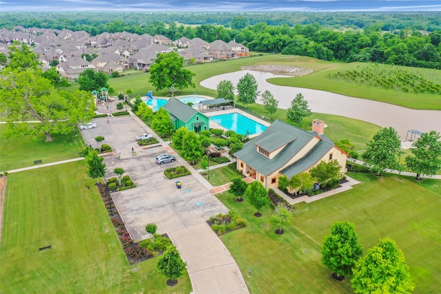 30307 Whistling Ln, Fulshear, TX 77441 - aerial perspective of suburban area with a pool area, a large body of water, and a golf course