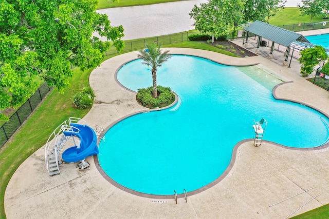 30307 Whistling Ln, Fulshear, TX 77441 - community pool featuring a water slide and a patio