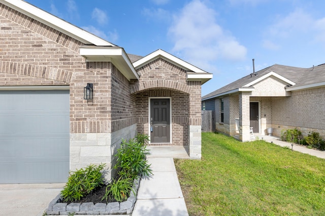 24719 Colony Meadow Trl, Huffman, TX 77336 - view of exterior entry featuring an attached garage, brick siding, and a lawn