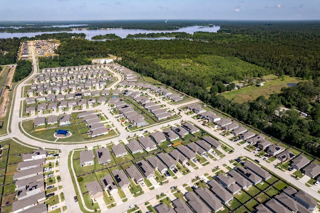 24719 Colony Meadow Trl, Huffman, TX 77336 - view of property location with a heavily wooded area, a large body of water, and nearby suburban area