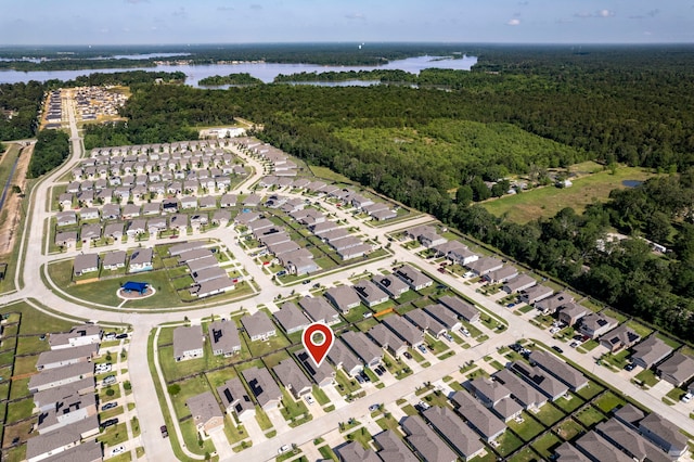 24719 Colony Meadow Trl, Huffman, TX 77336 - view of property location with a heavily wooded area, a nearby body of water, and nearby suburban area