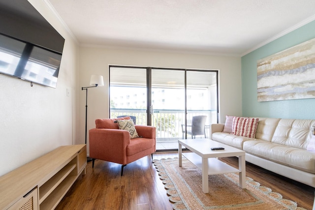 6102 Seawall Blvd Unit 140, Galveston, TX 77551 - living area with wood finished floors and ornamental molding