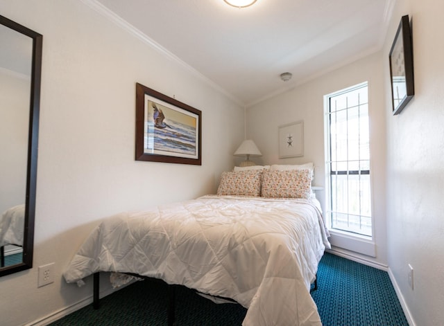 6102 Seawall Blvd Unit 140, Galveston, TX 77551 - bedroom with carpet floors, ornamental molding, and baseboards