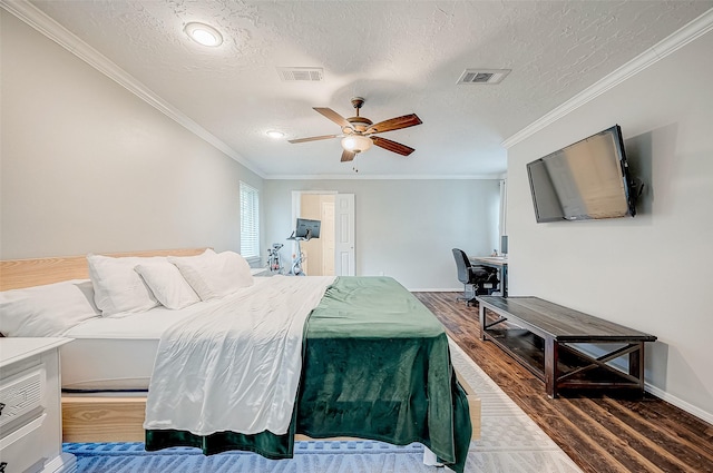 11607 Knobcrest Dr, Houston, TX 77070 - bedroom with wood finished floors, a textured ceiling, ornamental molding, ceiling fan, and baseboards