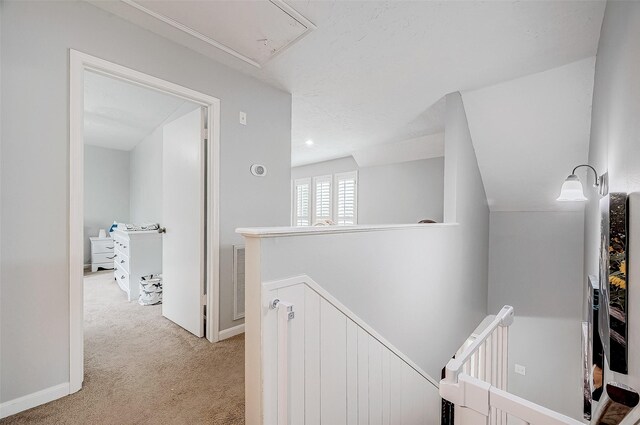 11607 Knobcrest Dr, Houston, TX 77070 - corridor with an upstairs landing, light carpet, attic access, and baseboards