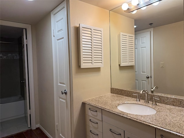 full bathroom featuring vanity and baseboards