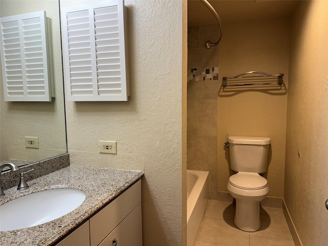 full bathroom with tile patterned floors, toilet, vanity, and shower / bath combination