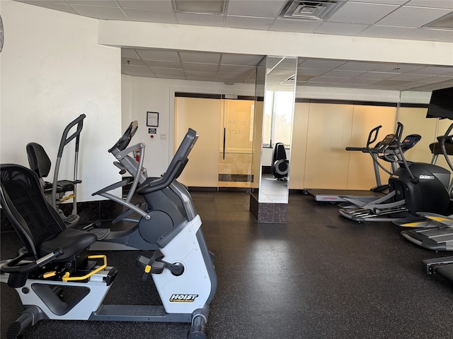 gym with a drop ceiling