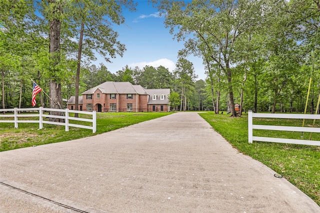 surrounding community featuring view of wooded area
