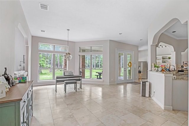 interior space featuring baseboards and light tile patterned flooring