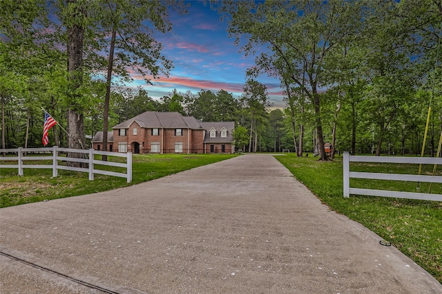 view of home's community featuring concrete driveway