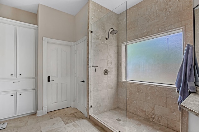 full bath with a walk in shower and stone finish flooring