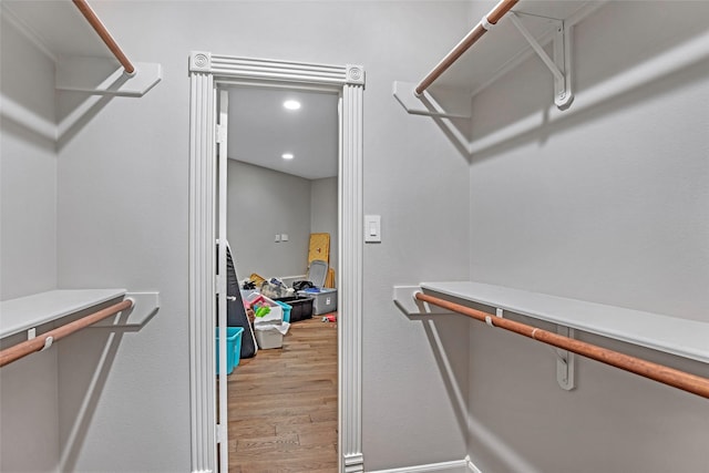 walk in closet featuring wood finished floors