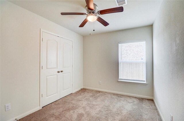 2037 Mule Rdg, Katy, TX 77493 - unfurnished bedroom featuring carpet floors, a closet, ceiling fan, and baseboards