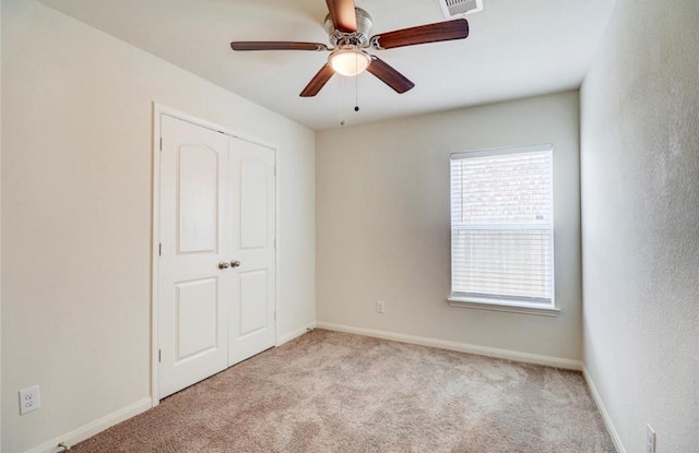 2037 Mule Rdg, Katy, TX 77493 - unfurnished bedroom featuring carpet flooring, a closet, baseboards, and ceiling fan
