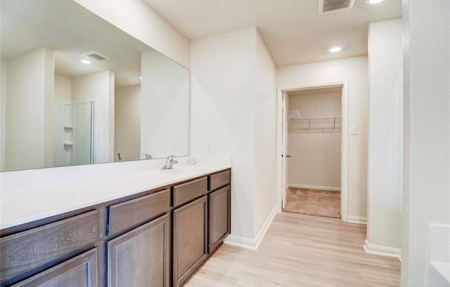 2037 Mule Rdg, Katy, TX 77493 - full bath with wood finished floors, a stall shower, baseboards, a spacious closet, and recessed lighting