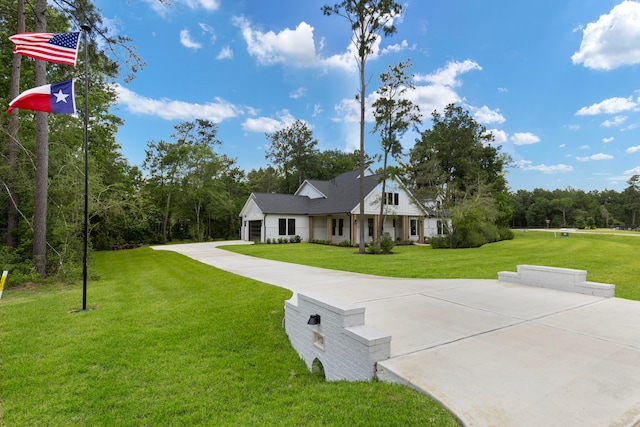 19720 Holly Creek Bnd, Magnolia, TX 77355 - modern farmhouse style home with a front lawn, an attached garage, and driveway