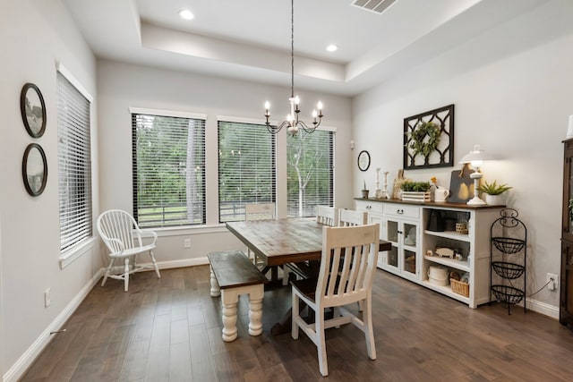19720 Holly Creek Bnd, Magnolia, TX 77355 - dining space featuring a raised ceiling, dark wood-style flooring, baseboards, a chandelier, and recessed lighting