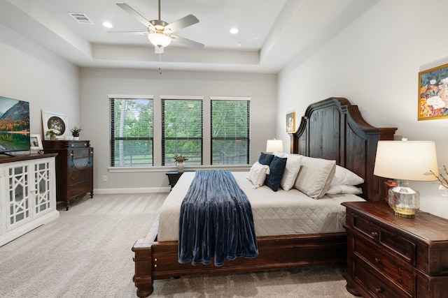 19720 Holly Creek Bnd, Magnolia, TX 77355 - carpeted bedroom with a raised ceiling, baseboards, and ceiling fan