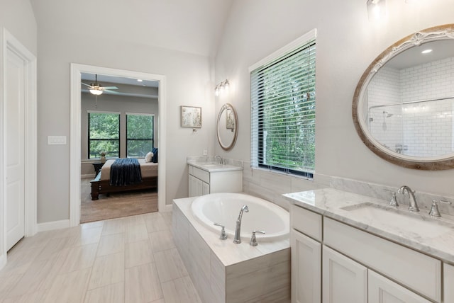 19720 Holly Creek Bnd, Magnolia, TX 77355 - full bath with a ceiling fan, a bath, plenty of natural light, tiled shower, and lofted ceiling