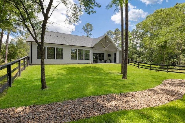 19720 Holly Creek Bnd, Magnolia, TX 77355 - back of house featuring a shingled roof and stucco siding