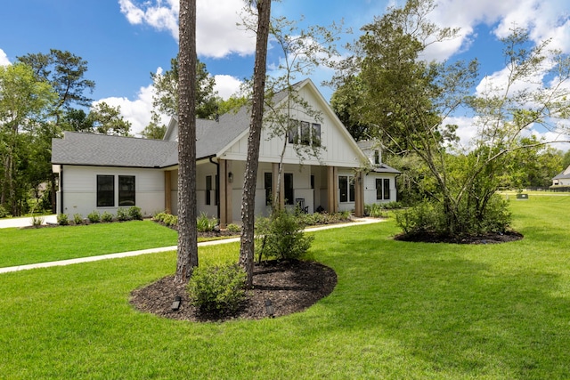19720 Holly Creek Bnd, Magnolia, TX 77355 - modern farmhouse featuring a front lawn and a shingled roof