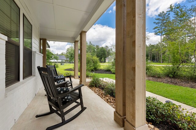 19720 Holly Creek Bnd, Magnolia, TX 77355 - view of patio featuring a porch