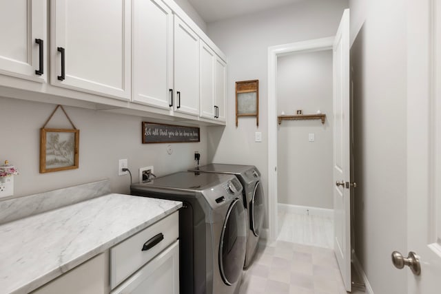 19720 Holly Creek Bnd, Magnolia, TX 77355 - washroom with cabinet space, independent washer and dryer, and baseboards