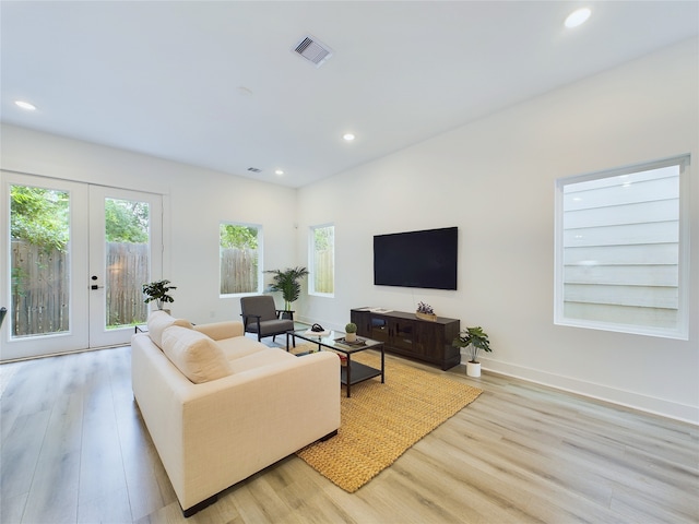 782 W Tidwell Rd Unit C, Houston, TX 77091 - living room featuring light wood-type flooring, french doors, recessed lighting, and baseboards