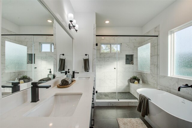 782 W Tidwell Rd Unit C, Houston, TX 77091 - full bathroom featuring plenty of natural light, a freestanding bath, a stall shower, double vanity, and recessed lighting