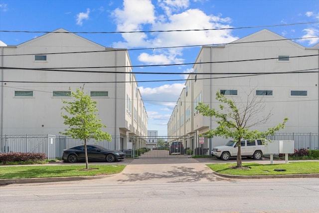 3115 Leeland St, Houston, TX 77003 - view of asphalt road with a gate and curbs