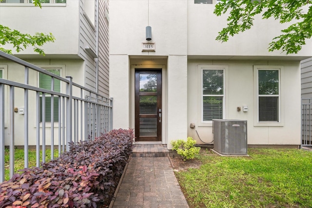 3115 Leeland St, Houston, TX 77003 - property entrance with central air condition unit, stucco siding, and fence
