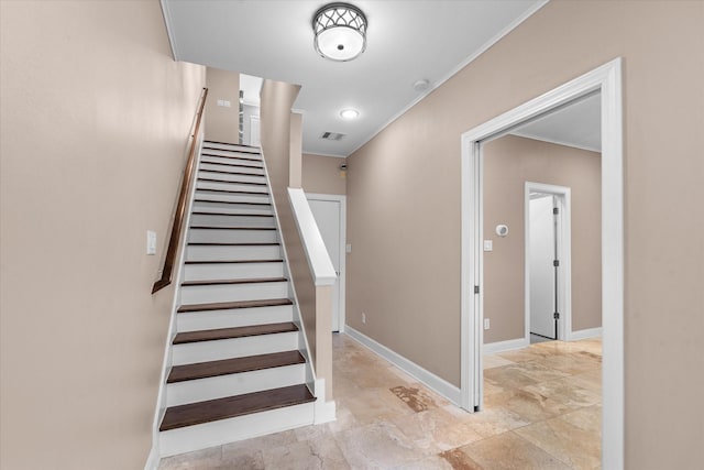 3115 Leeland St, Houston, TX 77003 - stairway with crown molding, stone finish floors, and baseboards