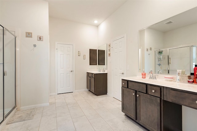 3314 Bastian Rd, Dickinson, TX 77539 - bathroom with a shower stall, two vanities, recessed lighting, and baseboards