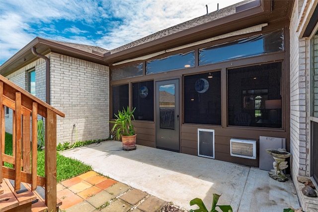 3314 Bastian Rd, Dickinson, TX 77539 - property entrance featuring brick siding and a patio