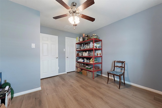 3314 Bastian Rd, Dickinson, TX 77539 - sitting room with light wood-type flooring, a ceiling fan, and baseboards