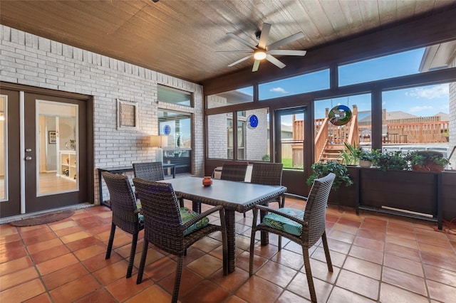 3314 Bastian Rd, Dickinson, TX 77539 - sunroom with plenty of natural light, brick wall, tile patterned flooring, and wood ceiling