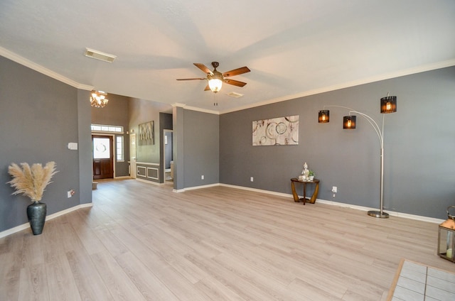 415 Wild Peach Pl, Missouri City, TX 77459 - unfurnished living room featuring light wood finished floors, crown molding, a ceiling fan, baseboards, and a chandelier