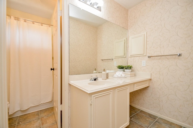 415 Wild Peach Pl, Missouri City, TX 77459 - bathroom featuring vanity, baseboards, wallpapered walls, tile patterned floors, and curtained shower