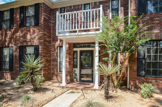 415 Wild Peach Pl, Missouri City, TX 77459 - doorway to property featuring a balcony and brick siding