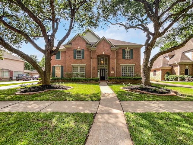 22014 Mission Hills Ln, Katy, TX 77450 - view of front of home featuring a front lawn and brick siding