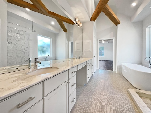 22014 Mission Hills Ln, Katy, TX 77450 - full bath with beamed ceiling, double vanity, a freestanding bath, a walk in shower, and recessed lighting