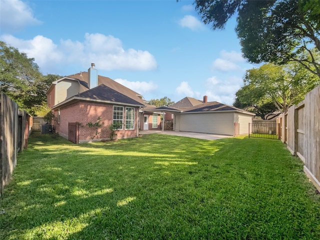 22014 Mission Hills Ln, Katy, TX 77450 - back of house featuring a patio, brick siding, cooling unit, and a chimney