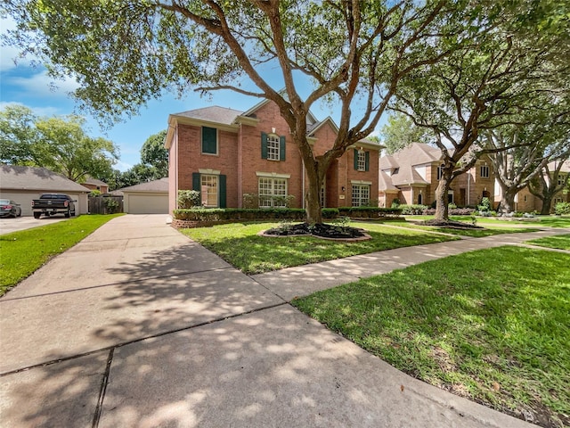 22014 Mission Hills Ln, Katy, TX 77450 - view of front of property featuring brick siding, a front lawn, a residential view, and a garage