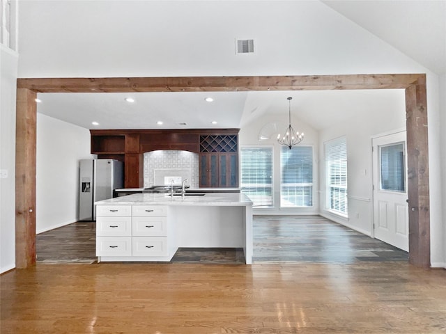 22014 Mission Hills Ln, Katy, TX 77450 - kitchen featuring stainless steel fridge, white cabinetry, light wood-type flooring, a sink, and light countertops