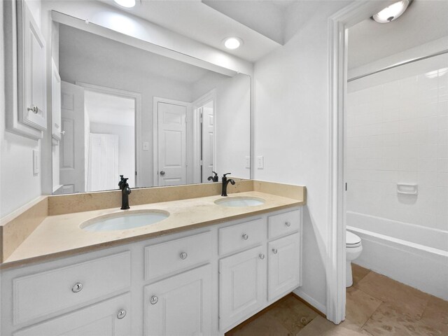 22014 Mission Hills Ln, Katy, TX 77450 - full bathroom featuring toilet, double vanity, and bathing tub / shower combination