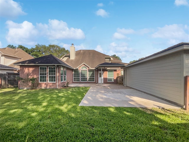 22014 Mission Hills Ln, Katy, TX 77450 - rear view of property with a patio area, a chimney, and brick siding