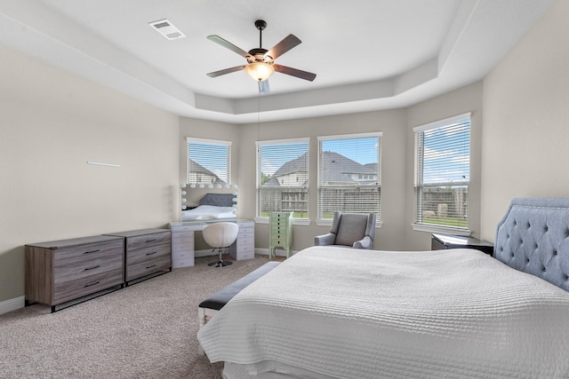 1810 Evergreen Bay Ln, Katy, TX 77494 - carpeted bedroom featuring a raised ceiling, baseboards, and ceiling fan