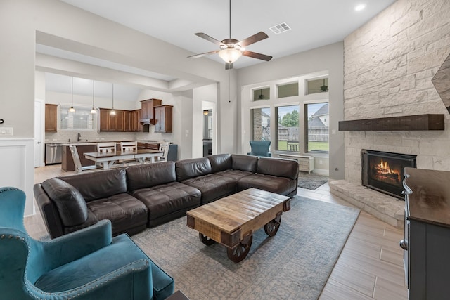 1810 Evergreen Bay Ln, Katy, TX 77494 - living area featuring a ceiling fan and a fireplace